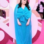 Scottish actress Sharon Rooney posing in a promotional photo for the BBC reality show Celebrity Traitors series two, Scottish actress Sharon Rooney known for My Mad Fat Diary and Barbie looking toward the camera, Official cast announcement graphic for Celebrity Traitors featuring actress Sharon Rooney, Sharon Rooney standing in front of a dark castle backdrop for The Traitors promotional material